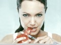 Angelina Jolie wallpapers: Angelina Jolie eating apple wallpaper