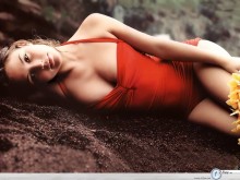 Josie Maran sexy in red on sand wallpaper