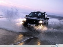 Land Rover Freelander going through water wallpaper