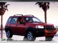 Land Rover wallpapers: Land Rover Freelander red near palms wallpaper