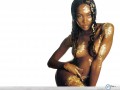 Naomi Campbell in gold wallpaper