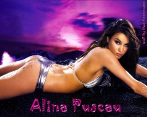 Stunning Alina Puscau lying on sand