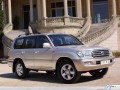 Toyota Land Cruiser by a house wallpaper